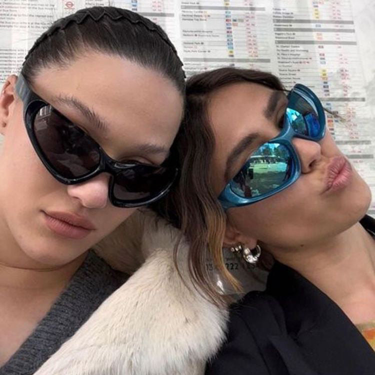 Shop 'Stunt Double' Rimless Y2K Sunglasses in Black & Chrome