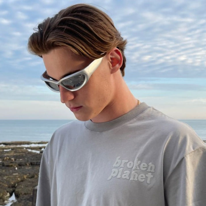 Shop 'Eridium' Y2K Wraparound Sunglasses in Silver